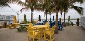 waterfront bar with tables and benches