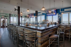 nice tall wooden bar inside restaurant