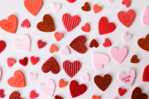 pink, red, and white hearts with simple messages on them